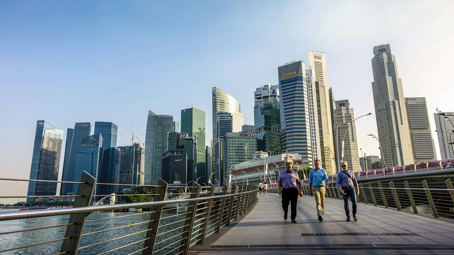 Modern office environment in Singapore with digital interfaces showing automated workflows and efficient business operations